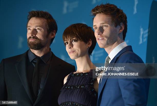Australian actor Hugh Jackman, US actress Anne Hathaway and British actor Eddie Redmayne pose during a photocall for the film "Les Miserables"...