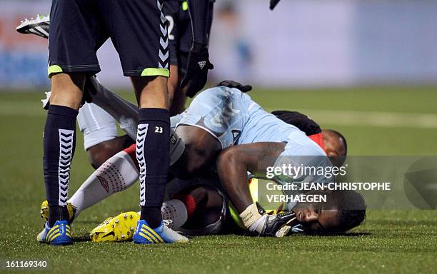 Reims' French-Haitian goalkeeper Johny Placide secures the ball from Nancy's Cameroonian forward Paul Alo'o Efoulou during their French L1 football...