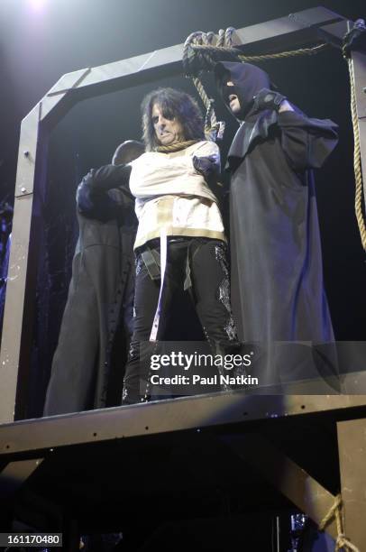 American heavy metal singer Alice Cooper and a pair of unidentified 'hangmen' perform at the Sears Centre in Hoffman Estates, Illinois, September 22,...