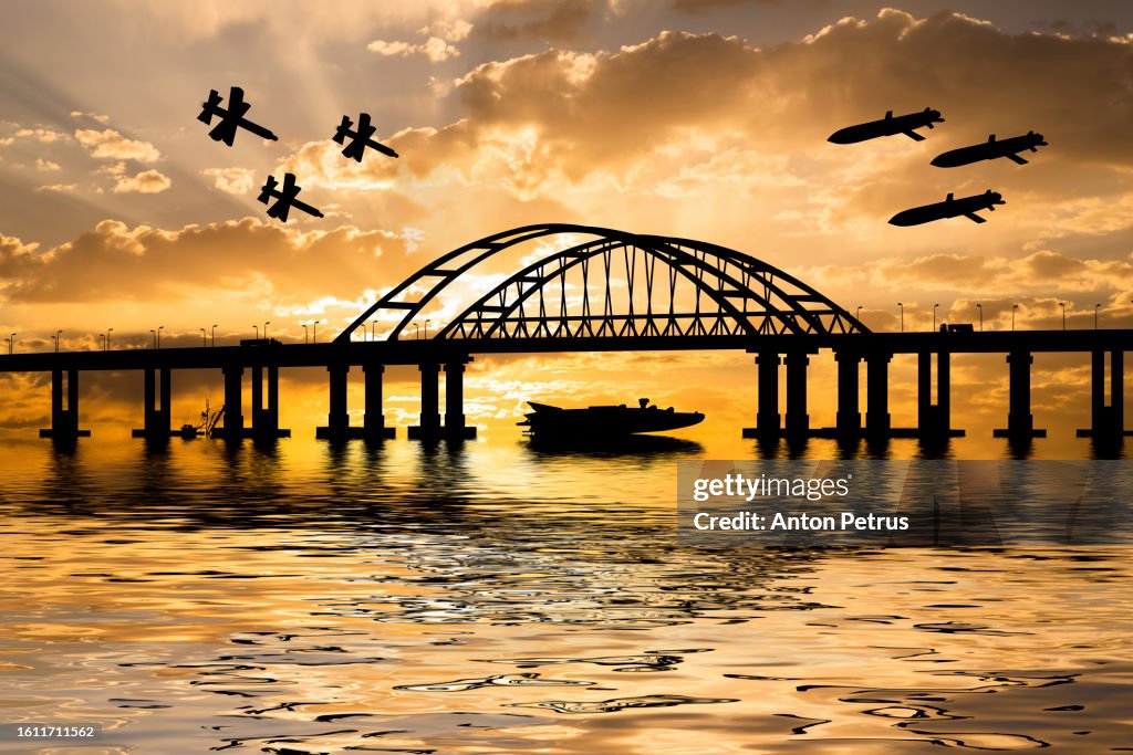 Cruise missiles and drones over the bridge at sunset. Crimea, Ukraine