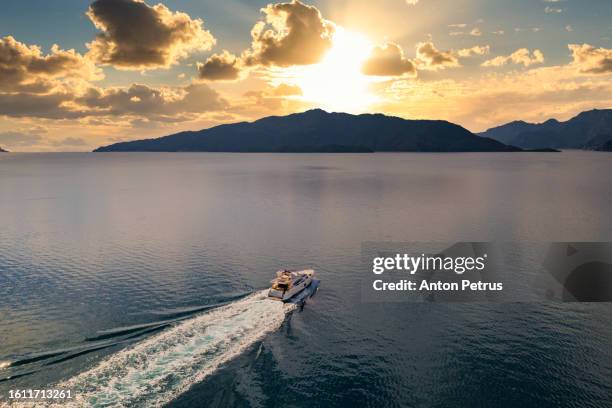 luxury motor yacht at sea, aerial view. vacation at sea - speed boat stock pictures, royalty-free photos & images