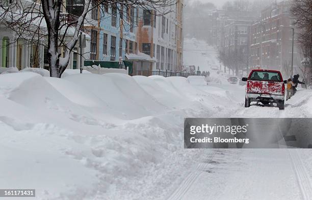 Snow plow drives down Brainerd Street after Winter Storm Nemo in Boston, Massachusetts, U.S., on Saturday, Feb. 9, 2013. More than two feet of snow...