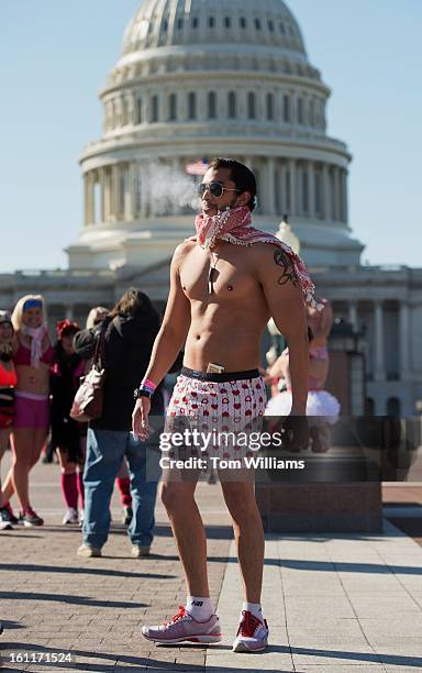 Runners takes a break on the east front of the Capitol, during Cupid's Undie Run on Capitol Hill. The 1 1/2 mile event raises money for The...