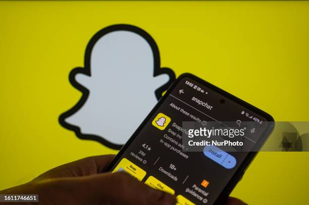 SnapChat app displayed on a smart phone with in the background SnapChat My AI, seen in this photo illustration, on August 20 in Brussels, Belgium.