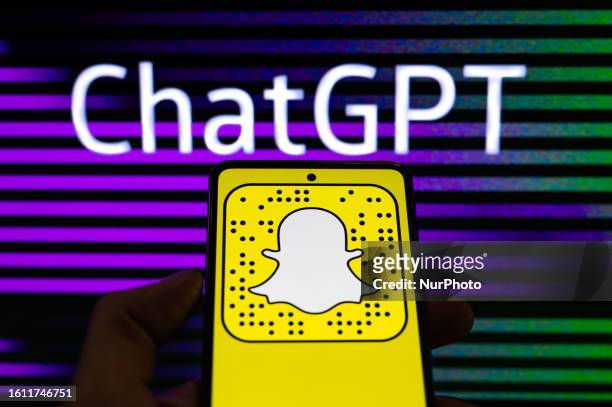 SnapChat icon displayed on a smart phone with in the background ChatGPT, seen in this photo illustration, on August 20 in Brussels, Belgium.
