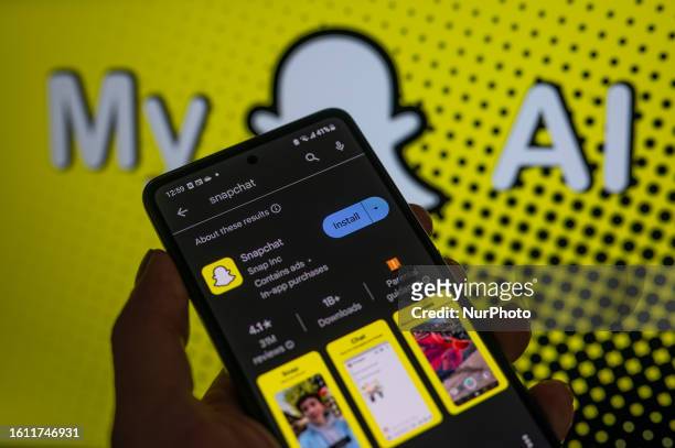 SnapChat app displayed on a smart phone with in the background SnapChat My AI, seen in this photo illustration, on August 20 in Brussels, Belgium.