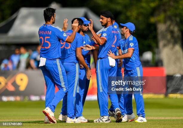 Dublin , Ireland - 20 August 2023; Arshdeep Singh of India, second from right, celebrates with teammates after catching out Paul Stirling of Ireland...