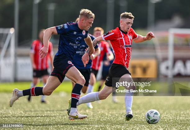 Derry , United Kingdom - 20 August 2023; Jamie McGonigle of Derry City in action against Jay McGrath of St Patrick's Athletic during the Sports...