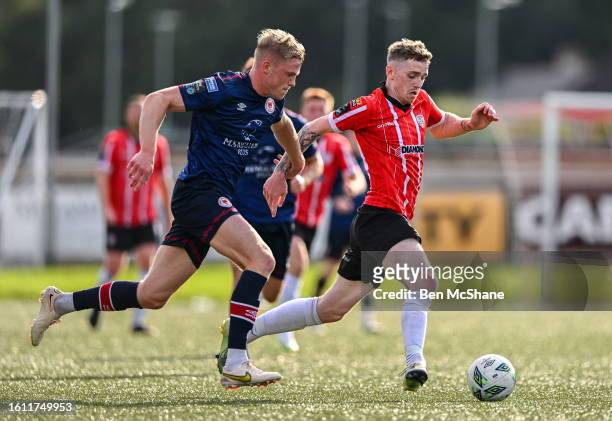 Derry , United Kingdom - 20 August 2023; Jamie McGonigle of Derry City in action against Jay McGrath of St Patrick's Athletic during the Sports...