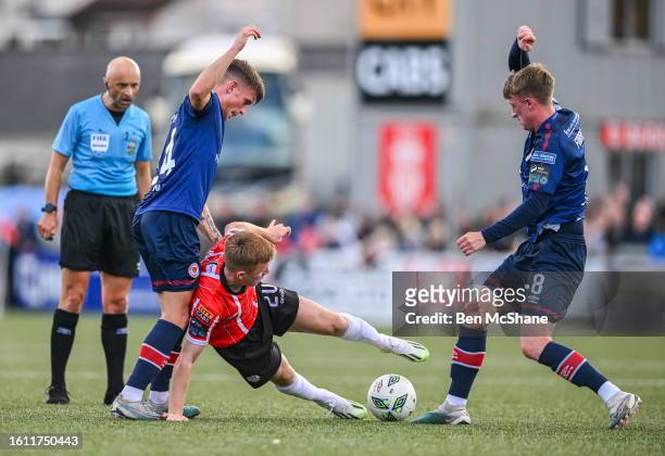 Derry , United Kingdom - 20 August 2023; Brandon Kavanagh of Derry City in action against Adam Murphy, left, and Chris Forrester of St Patrick's...