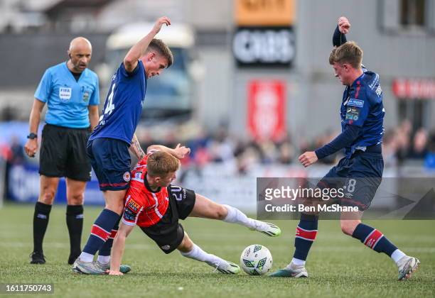 Derry , United Kingdom - 20 August 2023; Brandon Kavanagh of Derry City in action against Adam Murphy, left, and Chris Forrester of St Patrick's...