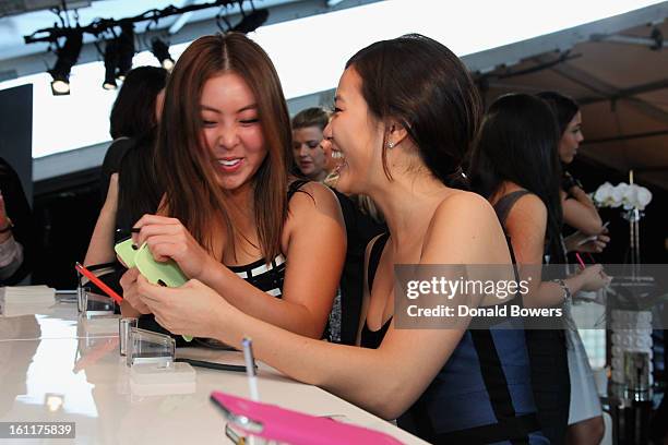 Guests attend the VIP reception for Herve Leger by Max Azria hosted by Samsung Galaxy Lounge at Mercedes-Benz Fashion Week Fall 2013 Collections at...