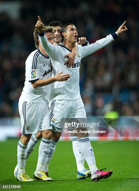 Cristiano Ronaldo of Real Madrid celebrates scoring his sides second goal with his teammates Fabio Coentrao and Raul Albiol during the la Liga match...