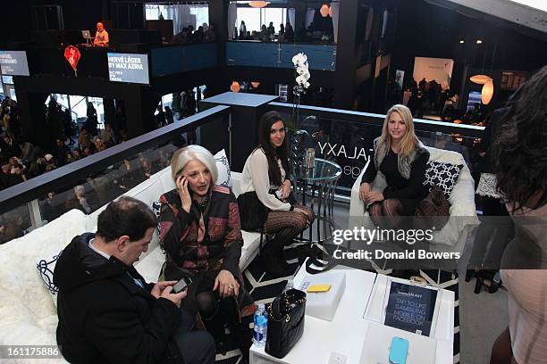 Guests attend the VIP reception for Herve Leger by Max Azria hosted by Samsung Galaxy Lounge at Mercedes-Benz Fashion Week Fall 2013 Collections at...