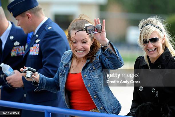 Amanda Eamosuinas, left, and Christine Osborn, right, greets cadets entering Falcon Stadium for the United States Air Force Academy 53rd Graduation,...