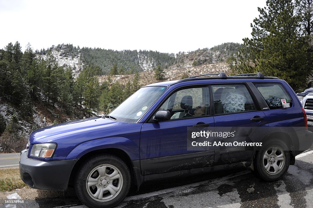 Ginger Borgeson sleeps in her vehicle at a road block in Buckhorn Canyon during the Crystal Mountain fire on Sunday, April 3, 2011. Borgeson said she was evacuated at around 12:30 a.m. when the fire grew from some 20 acres to more than 2,000 during the ni