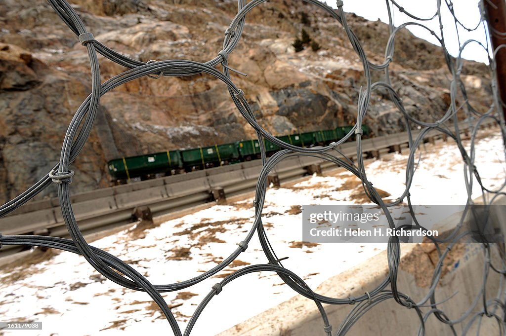 Precautions have been taken to protect the houses below the fall zone such as the installation of wire mesh nets to catch boulders, large green dumpsters at the base of the cliff and large concrete barriers to stop potential rolling r falling rocks. CDOT,