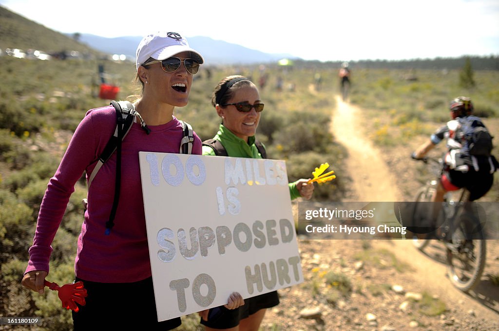 Krista Baumgartner of Denver, left, and Shelley Nelson of Denver cheer their friend by Twin Lakes during Leadville Trail100 MTB on Saturday. Hyoung Chang / The Denver Post