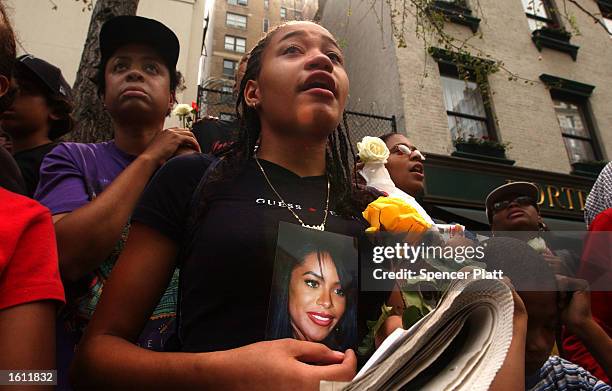 Fans mourn the death of R&B singer Aaliyah during the funeral service at St. Ignatius Loyola Church August 31, 2001 in New York City. The 22-year-old...