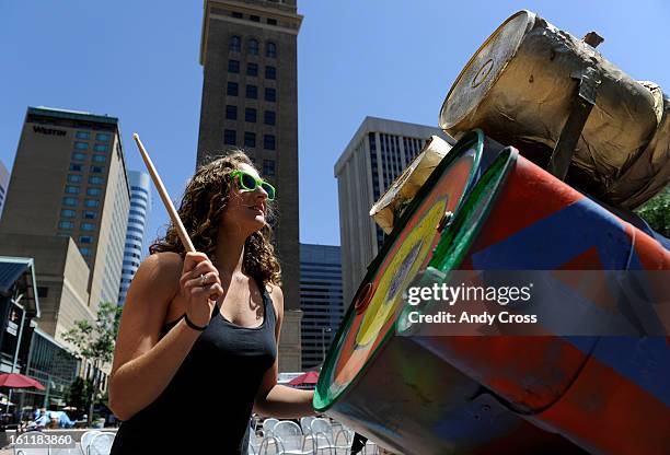 Pick Up America member, Kelly Klein, jams in a drum circle on drums from Pick Up America that were made out of garbage picked out of the Mississippi...