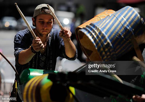 Pick Up America member, Davey Rogner, jams in a drum circle on drums from Pick Up America that were made out of garbage picked out of the Mississippi...