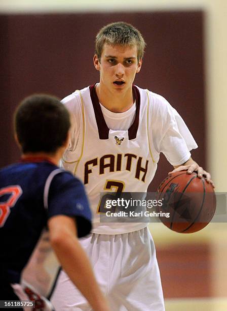 Eagles guard Nathan Rindels controlled the ball in the second half. The Faith Christian Academy boys basketball team defeated Kent Denver 70-54...