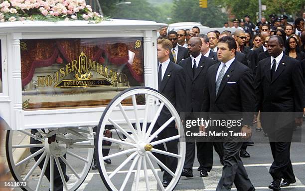 Horse-drawn carriage carries R&B singer Aaliyah''s coffin towards the St. Ignatius Loyola Church August 31, 2001 in New York City. The 22-year-old...