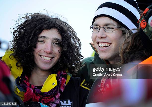 Winner of the men's Sprint U.S. Snowboarding Grand Prix Half Pipe finals at Copper Mountain, Luke Mitrani, left, is all smiles with snowboarder,...