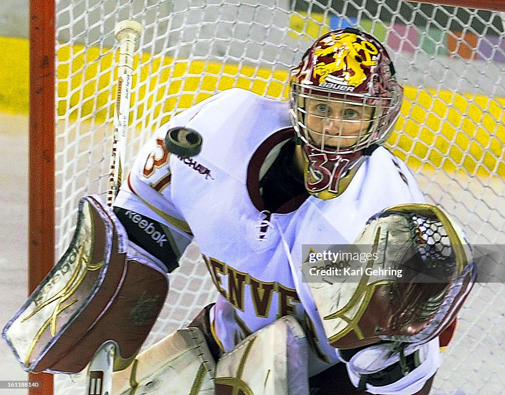 Denver goalie Juho Olkinuora made a glove save in the third period Saturday. The University of Denver hockey team was shut out 4-0 by Minnesota Duluth at Magness Arena Saturday night November 5, 2011. Karl Gehring,The Denver Post