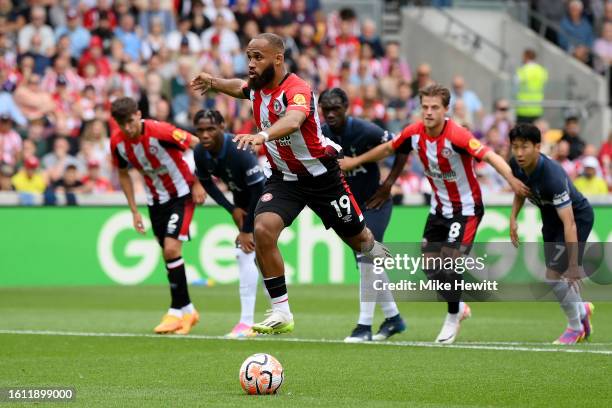 Bryan Mbeumo of Brentford scores the team's first goal from a penalty kick during the Premier League match between Brentford FC and Tottenham Hotspur...