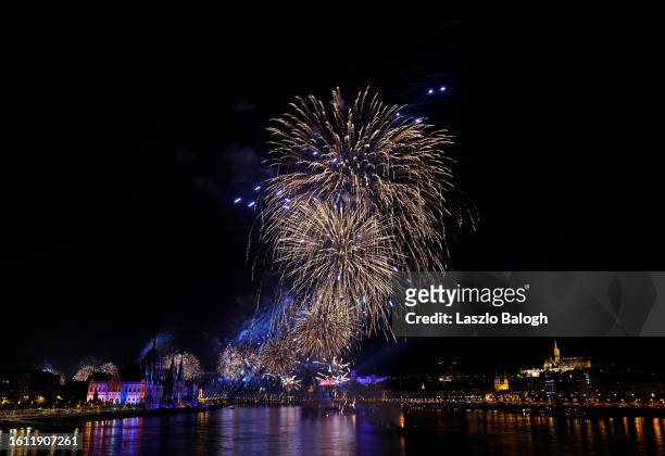St. Stephen's Day fireworks explode over the Danube River during day two of the World Athletics Championships Budapest 2023 at National Athletics...