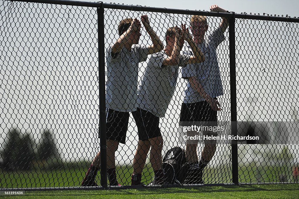 From left to right Victor Rolph, 15, Remington Ellis, 16, and Tristen Heath, 16, at the Dick's Sporting Goods Park for the U16 Developmental Academy soccer program, watch the Colorado Rapids as they practice today July 11, 2012. The team practiced on prac