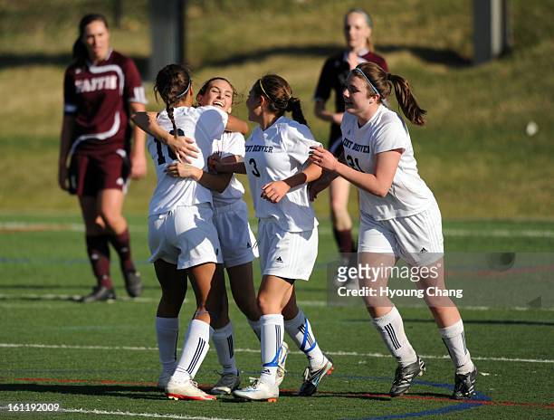 From front left, Kent Denver Havana McElvaine, Natalie Ricci, Aurie Pike and Krista D'Alessandro celebrate Ricci's winning goal of the game against...
