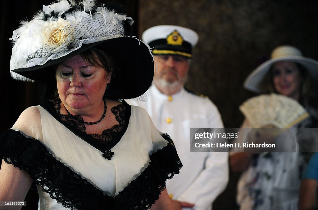 Janet Kalstrom, playing Molly Brown, John Steinle, middle, playing Captain Edward John Smith, captain of the Titanic and Mary Van Meter, a docent at the museum, reenacted the day of the sinking of the Titanic to a roomful of visitors. The Molly Brown Hous