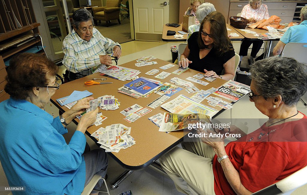 CENTENNIAL, CO--From left to right, Annie Trujillo, 89-years-old, Daphne Lovelace, 85-years-old, volunteer and coupon organizer, Lorna Bounds, and Eileen Fagen, 85-years-old, carefully cut out and organize coupons that will be sent overseas to U.S. milita