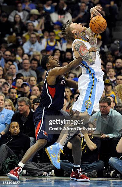Denver Nuggets center Chris Andersen draws contact from Atlanta Hawks shooting guard Joe Johnson during the second half of the Nuggets' 100-90 win on...