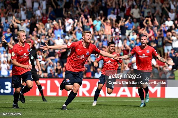 Mathias Fetsch of SpVgg Unterhaching celebrates after scoring the team's first goal during the DFB cup first round match between SpVgg Unterhaching...