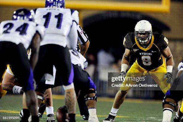 Wyoming Cowboys linebacker Brian Hendricks watches the Weber STate offense before the snap during the season opener at Jonah Field at War Memorial...