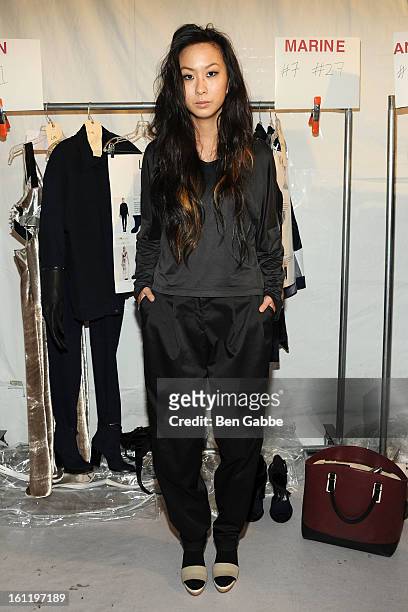 Designer Jen Kao poses backstage at the Jen Kao fall 2013 fashion show during Mercedes-Benz Fashion Week at Skylight Studios at Moynihan Station on...