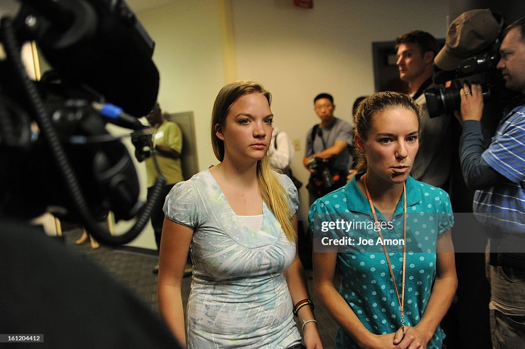 People walking in to the hearing for James Holmes, the man accused of killing 12 people and injuring 58 others in the movie theater shooting appeared before Arapahoe County District Court Judge William B. Sylvester Monday July 23, 2012 for an advisement h