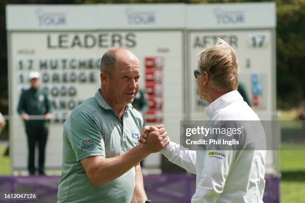 Greig Hutcheon of Scotland shakes hands with Philip Golding of England during Day Two of the Legends Tour Trophy hosted by Simon Khan at Hanbury...