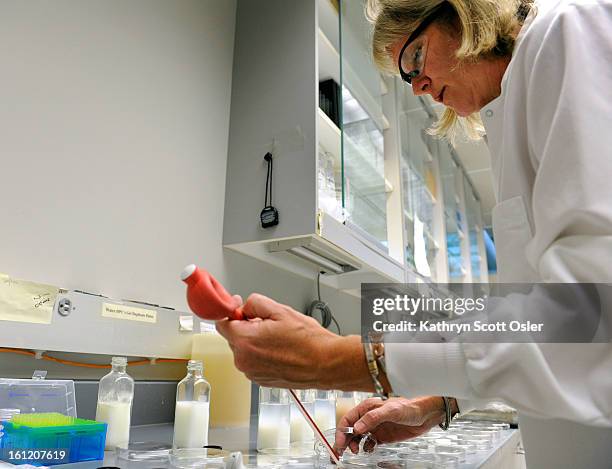 Physical Scientist Dee Jae Dutton performs tests on samples of pasteurized milk submitted every month from dairies across the state. The Colorado...