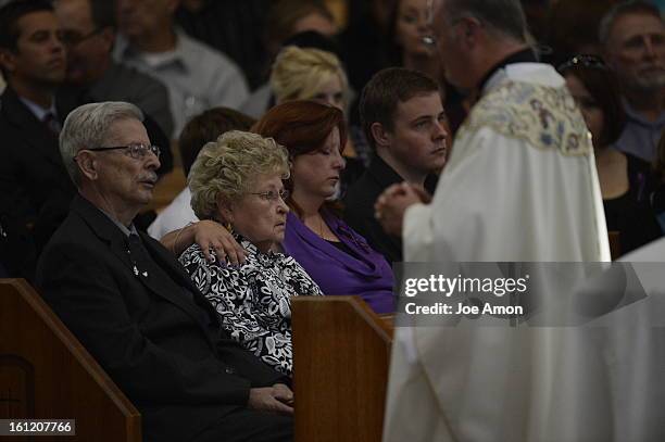 Bill and Sue Hoover set with her daughter Theresa Hoover and her son Wil Hoover 22 during the funeral 18 year old AJ Boik at his funeral Friday, July...