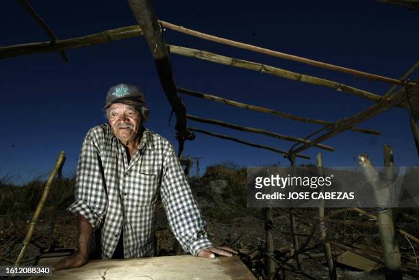 Alfonso Cruz resident of La Esperanza community in Soyapango, El Salvador, stands on January 4th in what is left of his poor house, after it was...