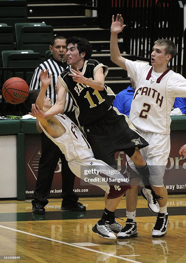 Faith Christian High School's Adam Finnefrock, left, draws a charge from Pagoas Springs' Zach Lucero, center, as Nathan Rindels, right, of Faith Christian, follows the ball, Friday, March 11, 2011, during final four action in the 3A boys basketball state