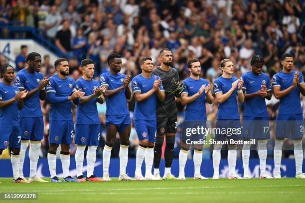 Players of Chelsea pause for a minutes applause in memory of former Chelsea Player and Manager John Hollins MBE prior to the Premier League match...