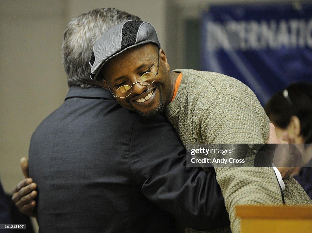 DENVER, CO--Union company taxi driver, Abdi Buni, right, hugs Mayoral candidate, Chris Romer on stage at the International Union of Operating Engineers Local 9, Thursday morning. The IUOE endorsed Romer during the event. Andy Cross, The Denver Post