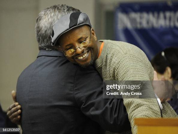 DENVER, CO--Union company taxi driver, Abdi Buni, right, hugs Mayoral candidate, Chris Romer on stage at the International Union of Operating Engineers Local 9, Thursday morning. The IUOE endorsed Romer during the event. Andy Cross, The Denver Post DENVER, CO--Union company taxi driver, Abdi Buni, right, hugs Mayoral candidate, Chris Romer on stage at the International Union of Operating Engineers Local 9, Thursday morning. The IUOE endorsed Romer during the event. Andy Cross, The Denver Post