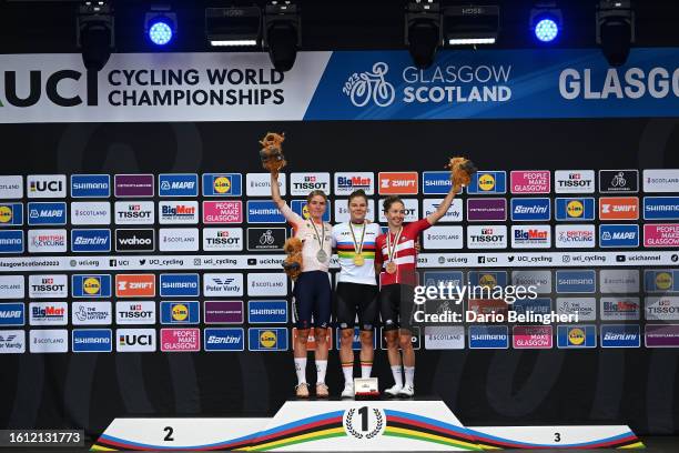 Silver medalist Demi Vollering of The Netherlands, gold medalist Lotte Kopecky of Belgium and bronze medalist Cecilie Ludwig of Denmark pose on the...