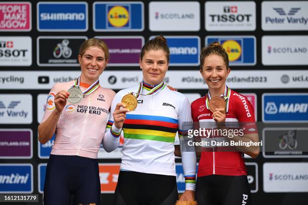 Silver medalist Demi Vollering of The Netherlands, gold medalist Lotte Kopecky of Belgium and bronze medalist Cecilie Ludwig of Denmark pose on the...